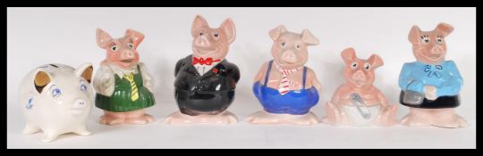 A set of original 20th century Wade Nat West banks complete with the stoppers together with a Wade