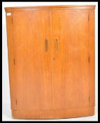 A mid century Danish influence teak wood bow front cocktail / drinks bar. The upper section with