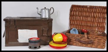A collection of vintage mid 20th Century picnic wares to include various plastic plates contained