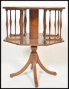 An early 20th century Edwardian mahogany revolving library bookcase of square form having boxwood