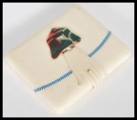 A vintage celluloid Art Deco 1920's cigarette case including a celluloid folded hand clasp with an