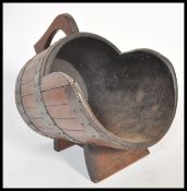 A 19th Century Victorian coal scuttle in the form of a coopered barrel having wooden body with
