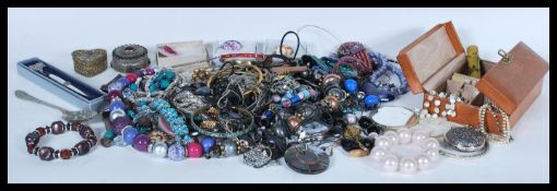 A group of vintage and contemporary costume jewellery to include bangles, bracelets, filigree