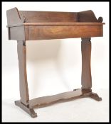 A 19th Regency mahogany writing table desk being raised on lyre shaped supports with a fitted frieze