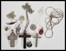 A selection of  silver pendants, chains and necklaces to include three different crosses, each