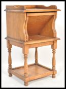 An unusual Victorian style oak whatnot / etagere 3 tier hall table stand with fold down reading