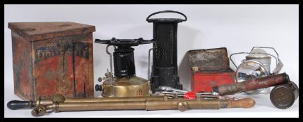 A collection of vintage 20th Century stoves and burners to include a tin boxed Primus stove, smaller