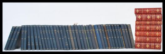 A large collection of several volumes of bound Punch Library of Humour books, dating from the 19th