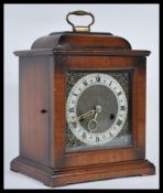 A vintage early to mid 20th Century Smiths Enfield walnut cased mantel bracket clock in the 17th