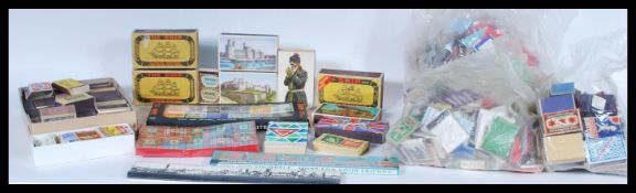 A large collection of vintage matchbox covers and boxed matches to include a set of boxed Stupid Ltd