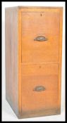 An early 20th century 1920's oak Industrial 2 drawer office filing cabinet of pedestal form. Each