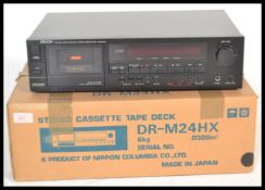 A retro Denon DR - M24Hx cassette deck tape player