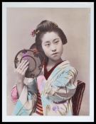 A late 19th Century Victorian hand - tinted albumen print photograph, the mounted studio