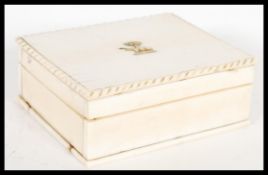 An early 20th Century Anglo Indian ivory desktop cigarette box,  the top of the box with gradroned