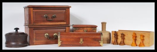 A selection of 20th Century treen ware items to include a desk box with two drawers having brass