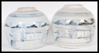 A pair of 19th century blue and white Chinese ginger jars. Simple form with scenes of village and