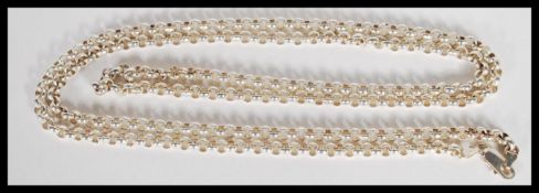 A stamped 925 silver longard chain having round links. Weight 105.5g. 116cm long.