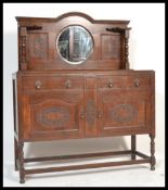 An early 20th century Edwardian mahogany mirror back sideboard, central oval bevel edged mirror