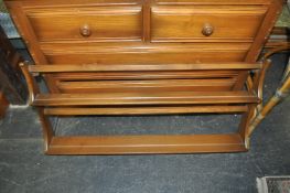 A 20th Century two tier Ercol blonde Delft plate rack with hanging brackets attached.