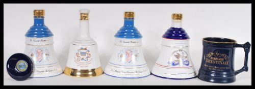 A selection of vintage commemorative Bell's Whisky two decanters to include the Queen Mother's