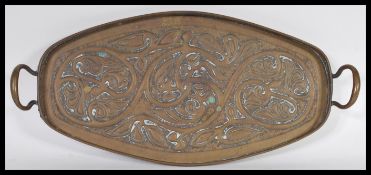 A vintage early 20th Century Newlyn style copper twin handled tray, the tray decorated with
