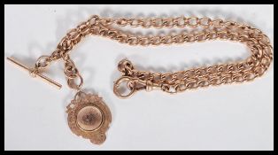 A 9ct gold Albert chain with twin t-bar and 9ct gold hallmarked fob medal, each link being stamped