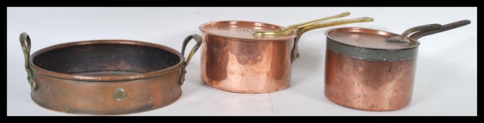A group of 19th century Victorian copper pans to include a Temple and Crook Ironmongers example
