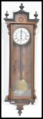 A 19th century large walnut cased Vienna regulator 8 day wall clock with glass door, enamel dial and