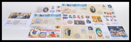 A collection of ten First Day Coin Covers to include military related, spitfire, Wallace and Gromit,