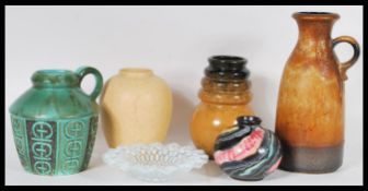 A collection of studio pottery vases to include West German pottery include a small bulbous form