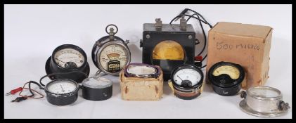 A collection of antique / vintage gauges and voltmeter, some of them with military marks. 10cm