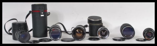 A selection of camera lenses to include a SMC Pentax-A Macro 1:2.8 50mm, Vivitar series 1 macro