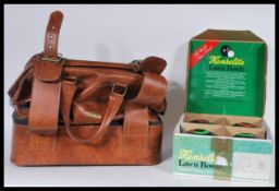 Two sets of vintage Lawn Bowls, one set within the original box and the other in a sports bag with