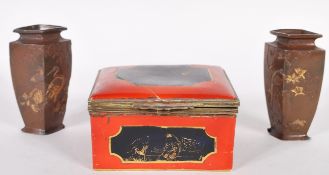 A pair of 19th Century Meiji period miniature cast bronzed vases, cast in relief with cranes and