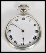 A mid 20th century silver white metal Longines pocket watch, having a white enameled face with roman