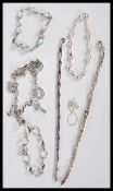 A selection of stamped 925 silver bracelets to include a spacer bracelet set with light blue stones,