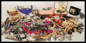 A collection of vintage costume jewellery to include rings, bracelets, necklaces, brooches,