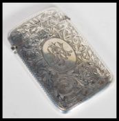 An early 20th Century George V hallmarked silver card case by William H Sparrow of curved form