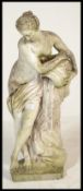 A 20th Century cast concrete composite weathered garden stoneware figurine in the form of a