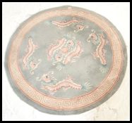 A 20th Century Chinese floor carpet rug of circula