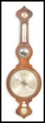 A 19th century Georgian mahogany barometer having a silvered dial with convex mirror glass,