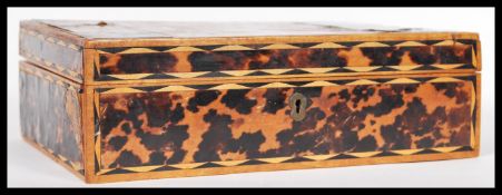 A 19th Century Indian blonde tortoiseshell work box of rectangular form having hinged lid opening to