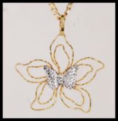 A stamped 375 9ct gold pendant necklace having a flat linked chain with a stamped 375 9ct gold