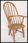 A 19th Century Victorian beech and elm Windsor hoop back childs childrens nursery chair raised on