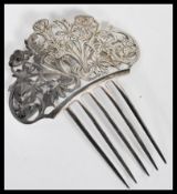 A vintage Tiffany & Co silver hair comb accessory with five prongs having a scrolled floral design