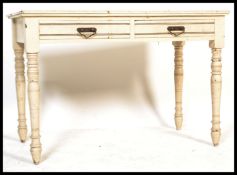 An early 20th Century Edwardian mahogany painted writing table / desk, twin drawers to front with