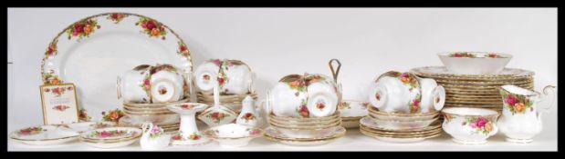 A Royal Albert Old Country Roses tea service having red rose pattern and gilt rims, to include tea