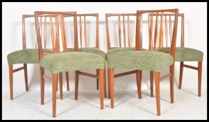A set of 6 mid century teak wood dining chairs in the manner of Peter Hayward for Vanson