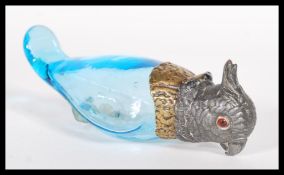 A 19th Century French Depose perfume bottle in the form of a bird having a opaque blue glass body
