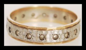 A hallmarked 9ct gold full eternity ring with with white stones. Hallmarked London. Total weight 2.